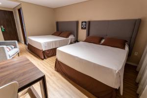 Postel nebo postele na pokoji v ubytování Hotel Village Premium Joao Pessoa