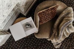 a picture of an eye and a book on the floor at H15 Hotel Francuski in Krakow