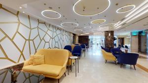 a salon with chairs and a waiting room at Ayass Hotel in Amman