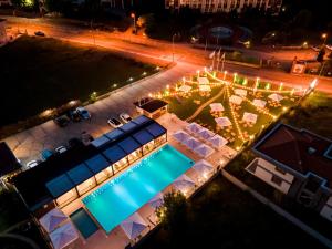 an overhead view of a swimming pool at night at Ucar Royal Hotel ve Konferans Salonu in Şile