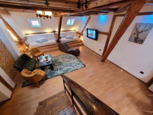 an overhead view of a living room with wooden beams at Main Square Apartments & More in Braşov