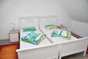 Postel nebo postele na pokoji v ubytování Föveny Apartmanok