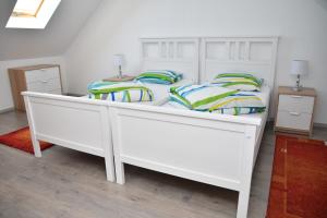 Postel nebo postele na pokoji v ubytování Föveny Apartmanok