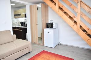 Kuchyň nebo kuchyňský kout v ubytování Föveny Apartmanok