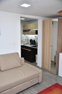 Kuchyň nebo kuchyňský kout v ubytování Föveny Apartmanok