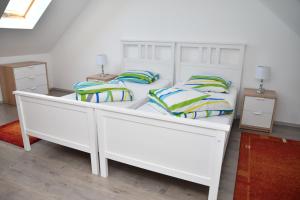Postel nebo postele na pokoji v ubytování Föveny Apartmanok