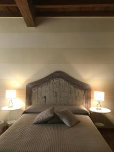 Rúm í herbergi á B&B Artincentro