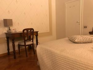 Rúm í herbergi á B&B Artincentro
