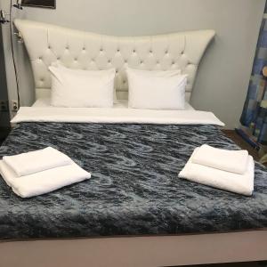 מיטה או מיטות בחדר ב-Мини Отель «Positive”