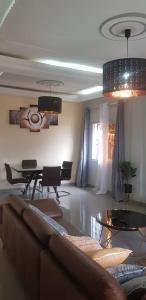 a living room with a couch and a table at Your home II in Yaoundé