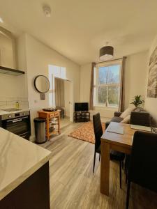 a living room with a table and a couch at Holgate hideout in York