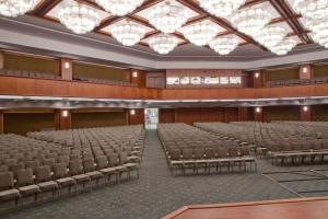 an empty auditorium with chairs and chandeliers at Eliz Hotel Convention Center Thermal Spa & Wellnes in Ankara