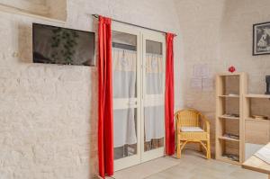 TV a/nebo společenská místnost v ubytování "Maison Pulli B&B" - Cozy Stay near Bari & Sea + 4 fotografie
