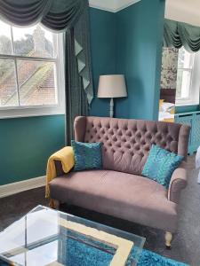 a living room with a couch and a window at Marley House Bed and Breakfast in Winfrith Newburgh