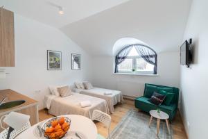 a living room with a couch and a table at Apartments24 Spordi in Rakvere