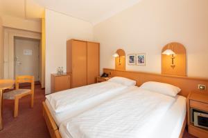 Postel nebo postele na pokoji v ubytování Hotel Terrace