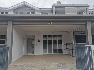 a house with a garage with the door open at Padang Besar Homestay in Padang Besar