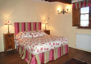 A bed or beds in a room at I Grandi Di Toscana