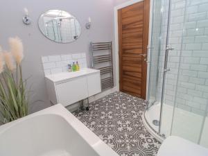 a bathroom with a shower and a sink and a toilet at Stackyard in Durham +58 photos