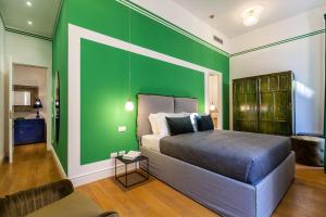 A bed or beds in a room at Suite della Pigna