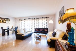 a living room with two couches and a dining room at Le Joffre Grimaldi Nice AP2089 in Nice
