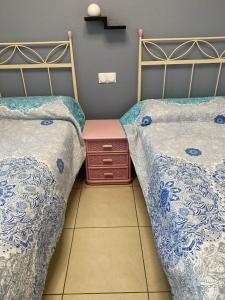 Un pat sau paturi într-o cameră la OLIVA NOVA GOLF BEACH & RESORT Club Sevilla V