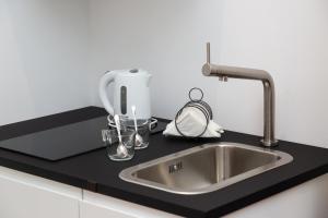 A kitchen or kitchenette at Suite della Pigna