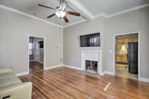 an empty living room with a ceiling fan and a fireplace at Columbia Home with Spacious Yard Less Than 2 Mi to Dtwn in Columbia