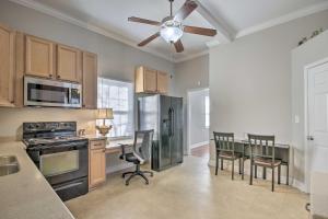 a kitchen with a ceiling fan and a table with chairs at Columbia Home with Spacious Yard Less Than 2 Mi to Dtwn in Columbia