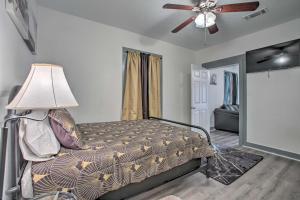 a bedroom with a bed and a ceiling fan at Uptown NOLA Abode, 4 Miles to the French Quarter! in New Orleans