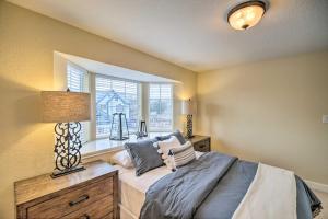 a bedroom with a bed and a window at Apt with Balconies - Steps to Kemah Boardwalk! in Kemah