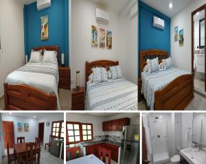 卡塔赫納的住宿－APARTAMENTOS DECOR，蓝色墙壁客房的两张床