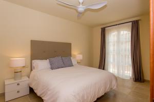 A bed or beds in a room at Manilva Townhouse with spectacular views of Gibraltar