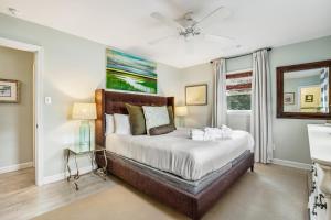 a bedroom with a large bed and a window at 1470 Barbara in Charleston