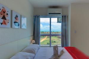 Giường trong phòng chung tại Beach Townhouses #C7 - Com jacuzzi by Carpediem