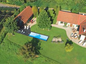 an aerial view of a house with a swimming pool at Landhaus Austria, Fehring in Fehring