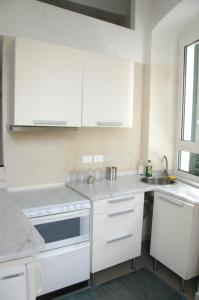 a kitchen with white appliances and a sink at Lerici Home in Lerici +63 photos