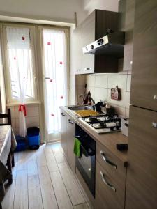 a kitchen with a stove and a stove top oven at Distretto 14 in Rome