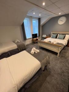 Ένα ή περισσότερα κρεβάτια σε δωμάτιο στο The Wilton Hotel +30 φωτογραφίες