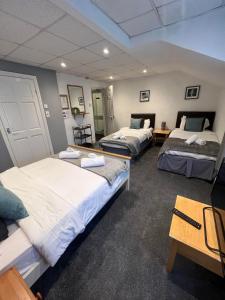 Ένα ή περισσότερα κρεβάτια σε δωμάτιο στο The Wilton Hotel