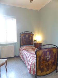 A bed or beds in a room at Il Casale Még 27 kép