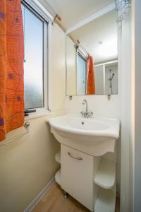 Kúpeľňa v ubytovaní Lipicai Apartmanházak + 31 fotografií
