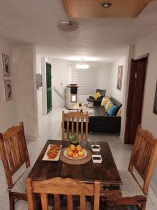 a living room with a table and a couch at Cosy Appartement in Majdal Shams