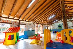 a play room with many different types of play equipment at Hotel Pousada Tambayba in Maresias