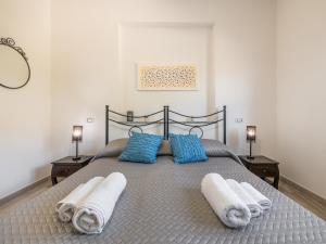 Säng eller sängar i ett rum på Villa Chiara Solanas