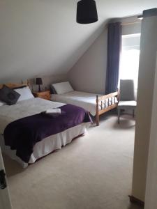 Voodi või voodid majutusasutuse The Curragh Country House Accommodation toas