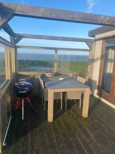 Balkón nebo terasa v ubytování Chalet Meerblick Wattenmeer