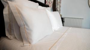 A bed or beds in a room at Solar Quinta da Portela - Douro
