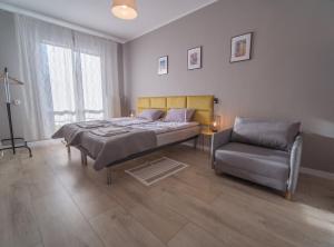 Posteľ alebo postele v izbe v ubytovaní Krosna Street Apartament