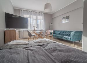 Posteľ alebo postele v izbe v ubytovaní Krosna Street Apartament